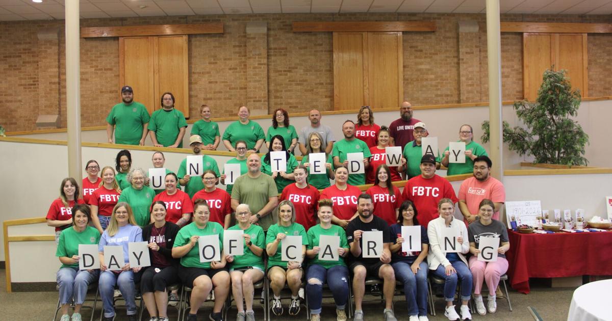 Volunteers from local banks organizing storage rooms at Duncan Little Theatre during community service day