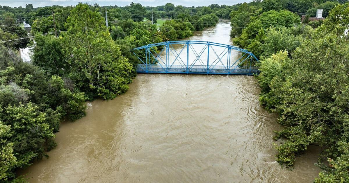 Anderson firefighters navigate rescue boat through White River floodwaters near Grant Avenue