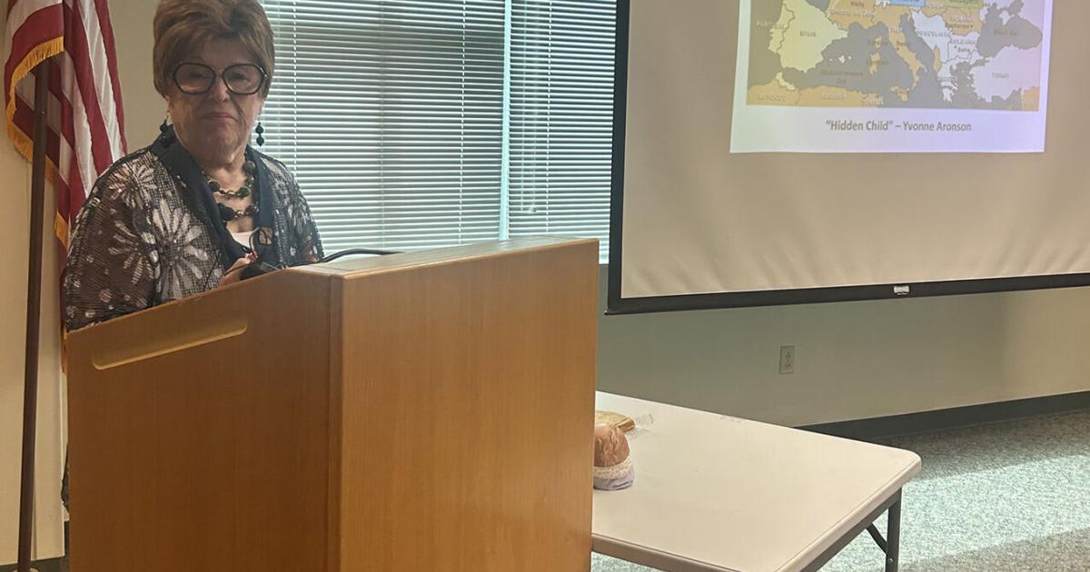 Elderly Holocaust survivor Yvonne Aronson speaking at Burlington Public Library presentation