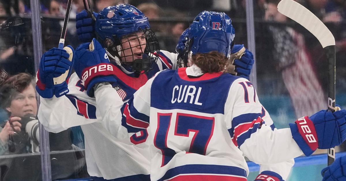 Caroline Harvey celebrates with Team USA teammates after scoring against Canada at 2026 Winter Olympics