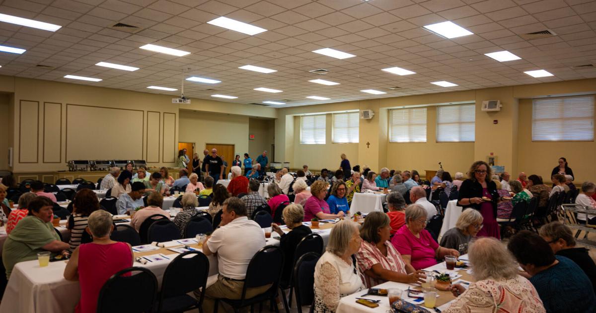 ** Cancer survivors and caregivers gather at St. Thomas More Catholic Church for Mercy Health celebration