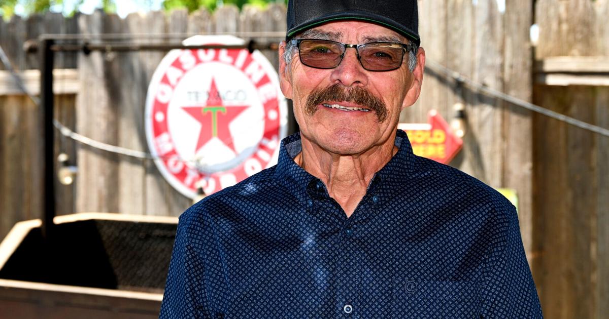 Gilbert Rea grilling tri-tip barbecue outdoors for his family gathering in Orcutt, California