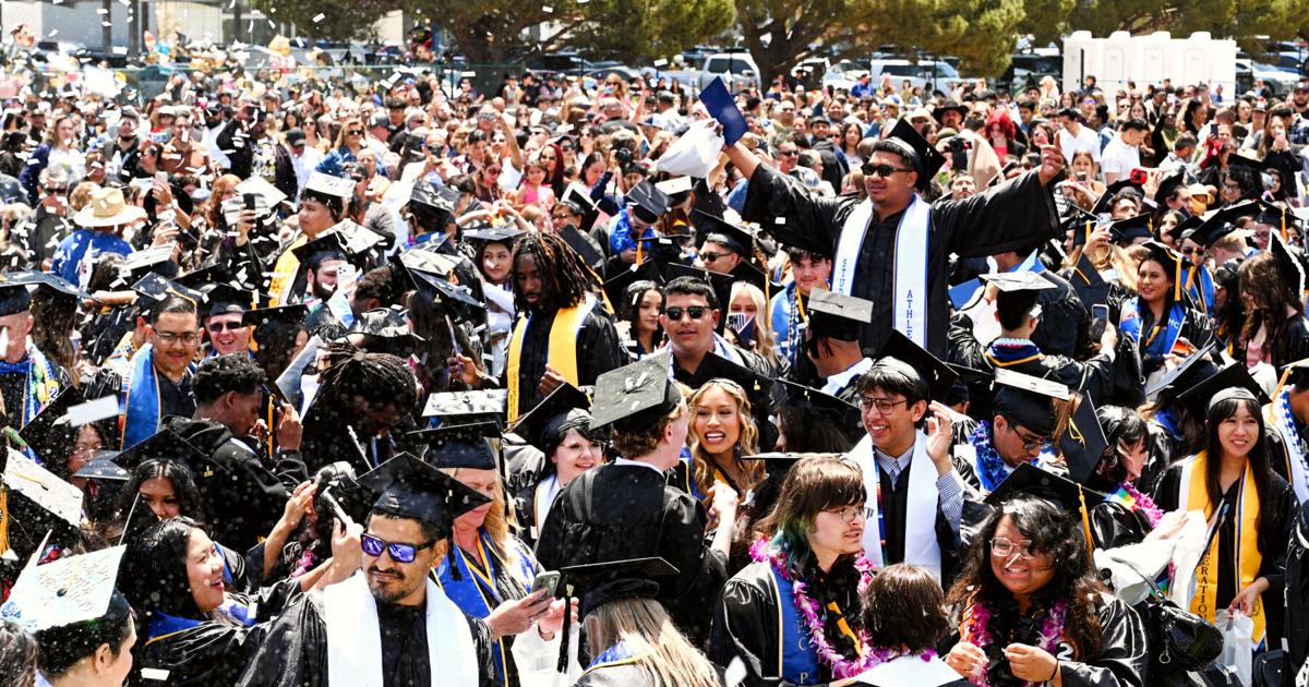 Allan Hancock College graduates in caps and gowns celebrate at outdoor commencement ceremony