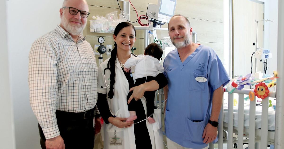 Medical team at Israeli children's hospital with young patient receiving groundbreaking gene therapy treatment