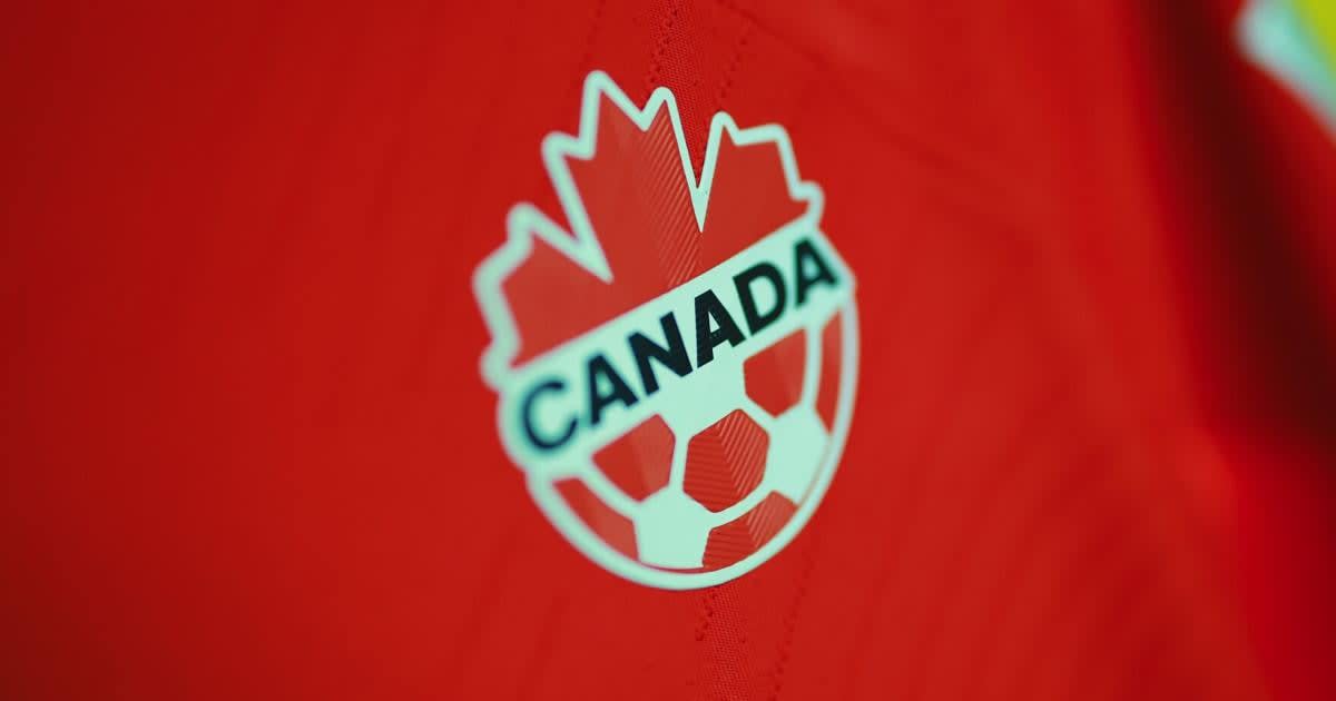 Canadian national soccer team players celebrating on field during international competition