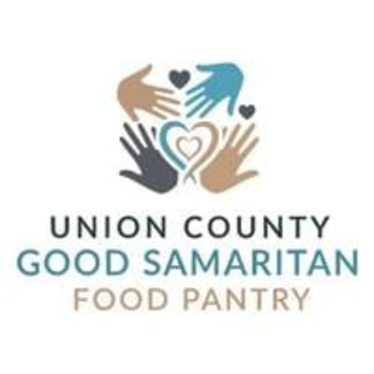 Food bank volunteers organizing donations inside Good Samaritan Center in Union County Mississippi