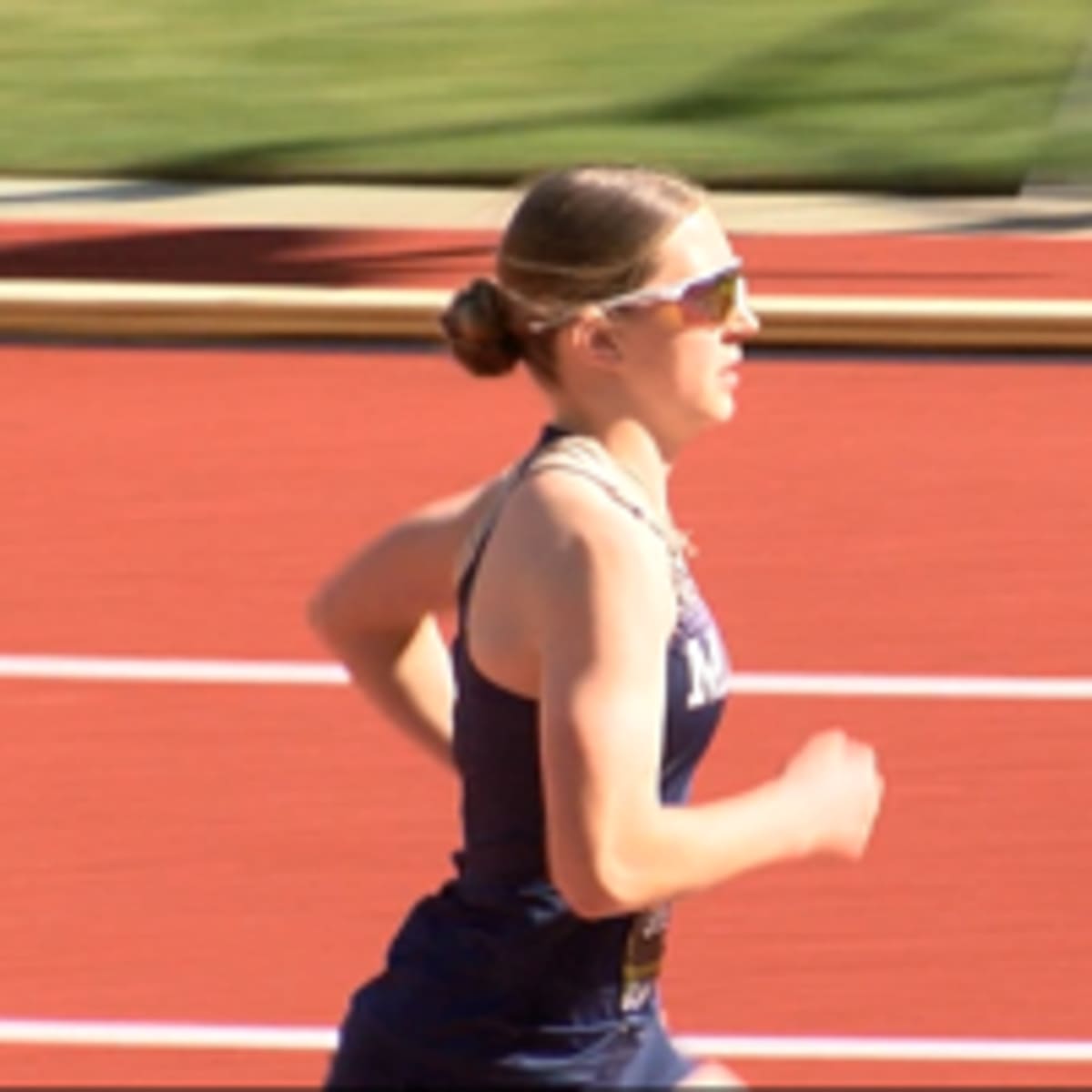 High school runner Tori Sherman competing on outdoor track in Oregon
