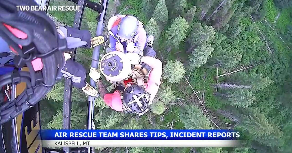 Two Bear Air Rescue helicopter preparing for emergency mission in Montana mountains
