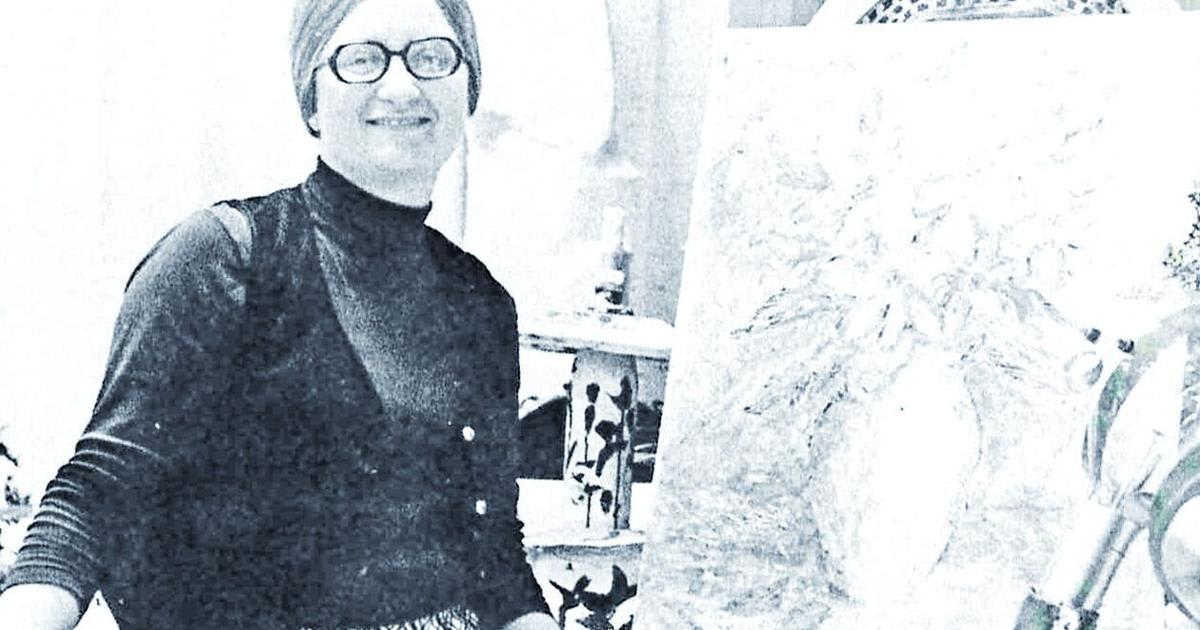 Former Ripon High School art teacher Margaret Klapperich sitting beside student artwork