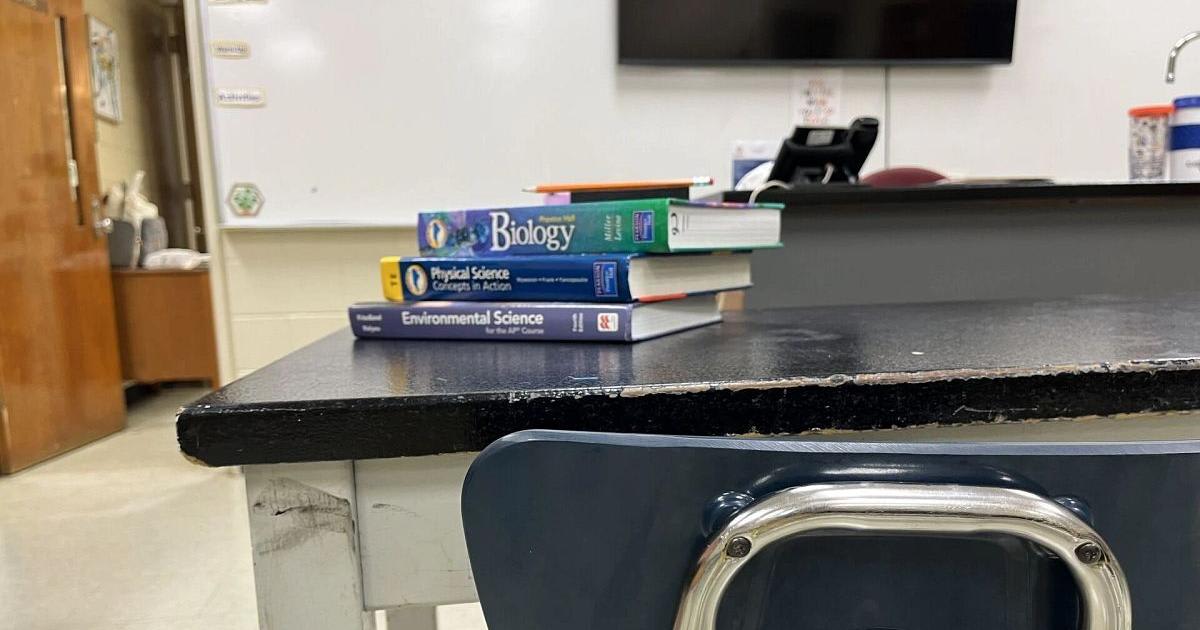 High school graduates in caps and gowns celebrating at Minnesota graduation ceremony