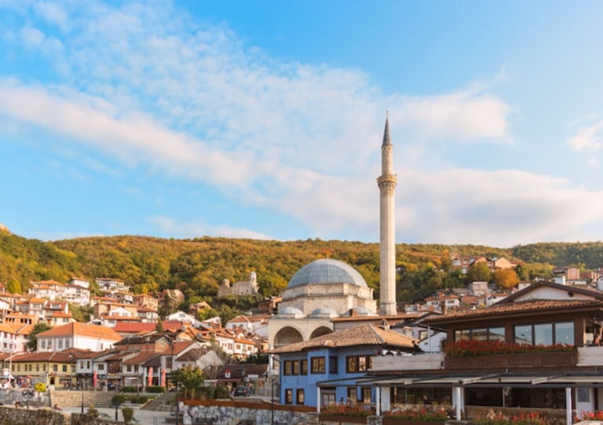 ** Modern apartment buildings under construction in Kosovo funded by diaspora investment programs
