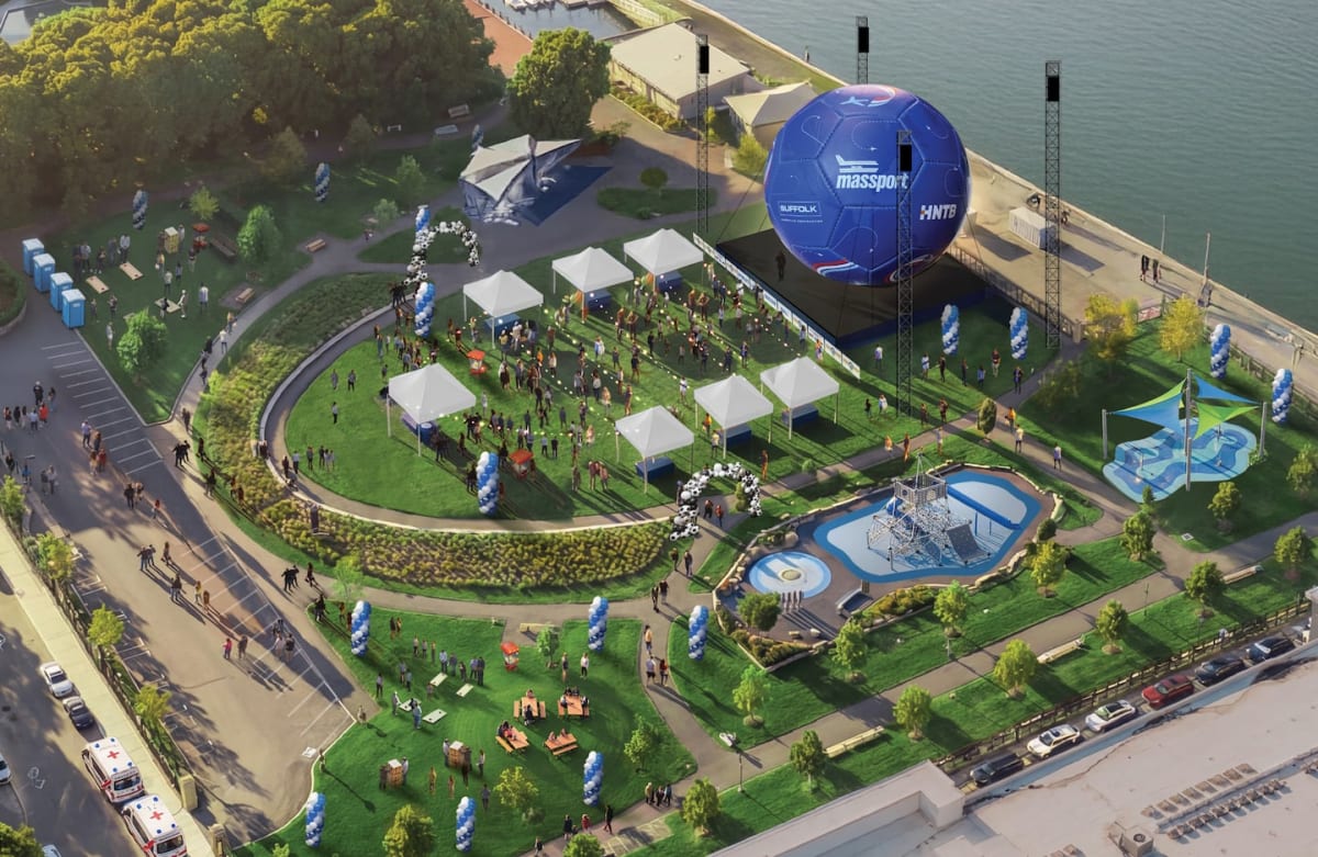 Massive 45-foot soccer ball installation towering over Boston's Piers Park waterfront near harbor