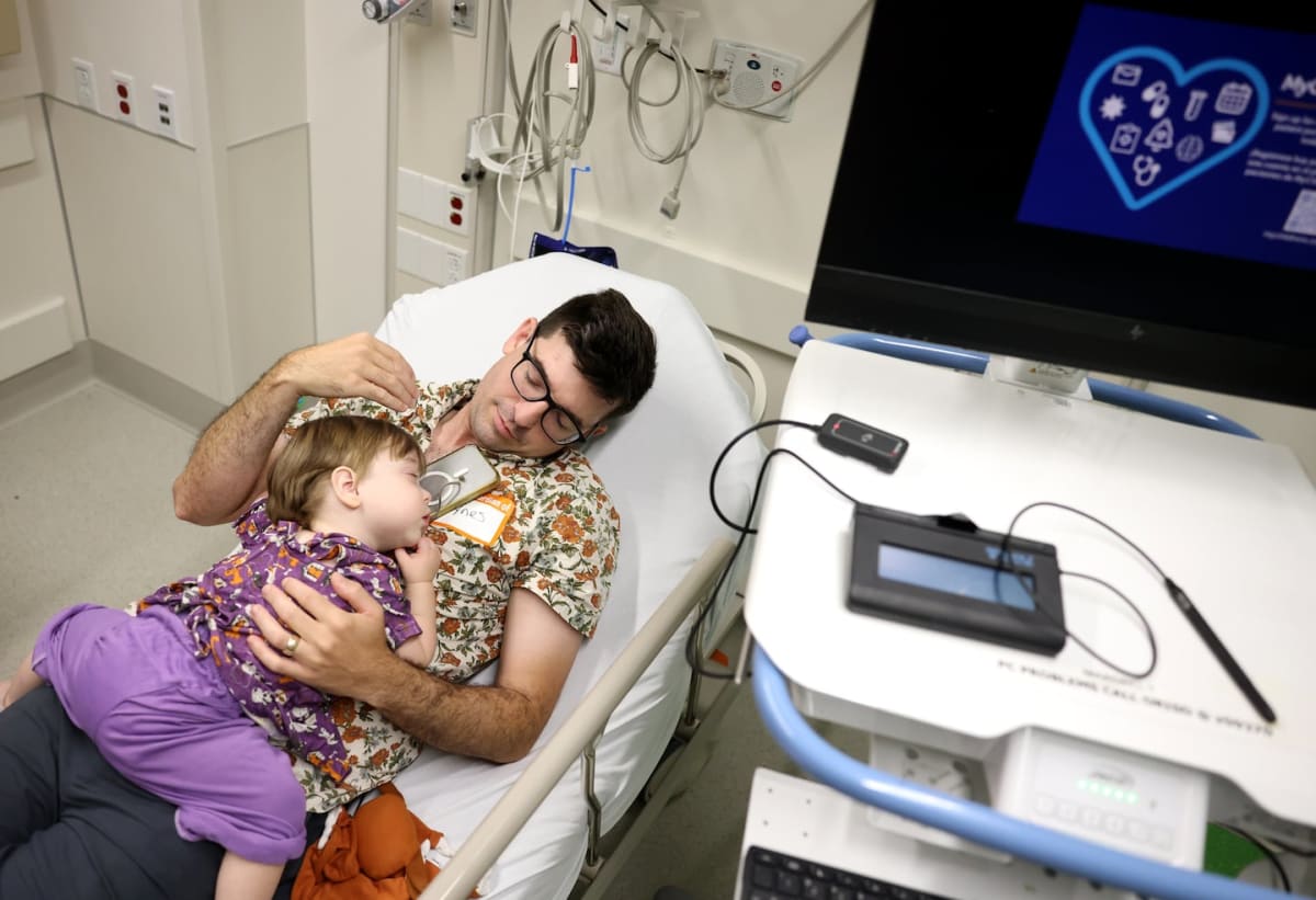 Young boy Everett Tynes in hospital bed before groundbreaking gene therapy treatment at Boston Children's Hospital