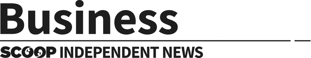 Hydroelectric dam with water flowing surrounded by lush green New Zealand landscape