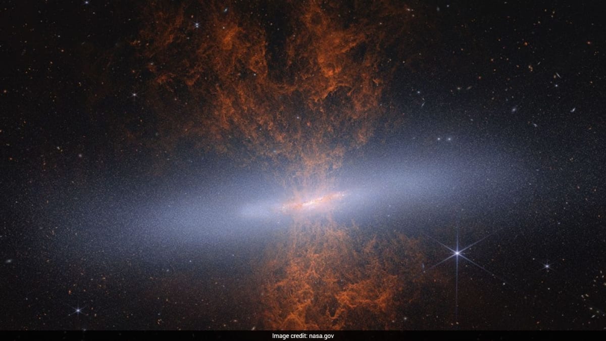 Webb Telescope's infrared composite image showing the Cigar Galaxy's star-forming regions in vibrant colors