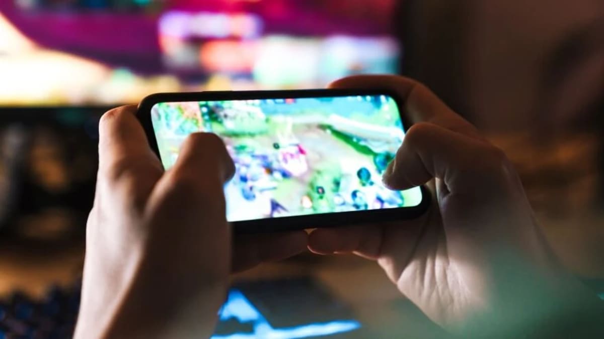 African game developers working on computers creating mobile and console video games
