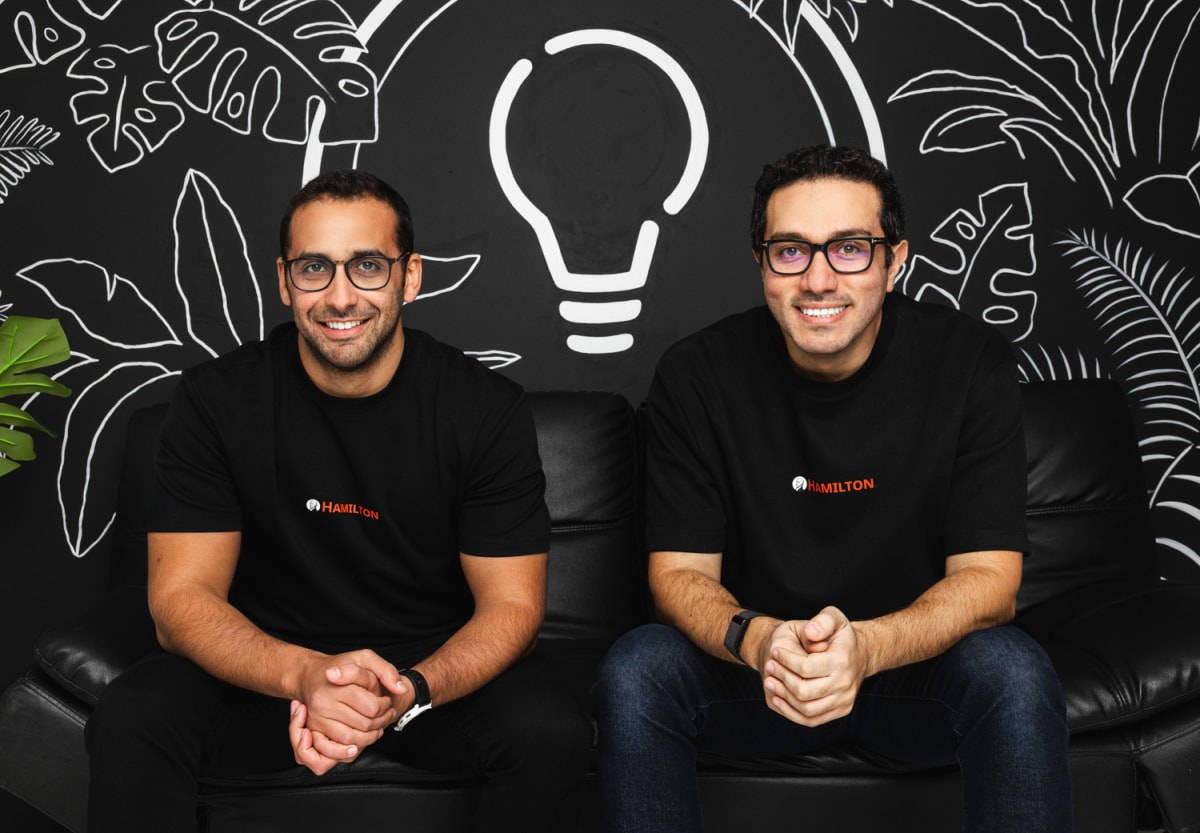 Person using mobile phone to access digital banking and savings in Africa