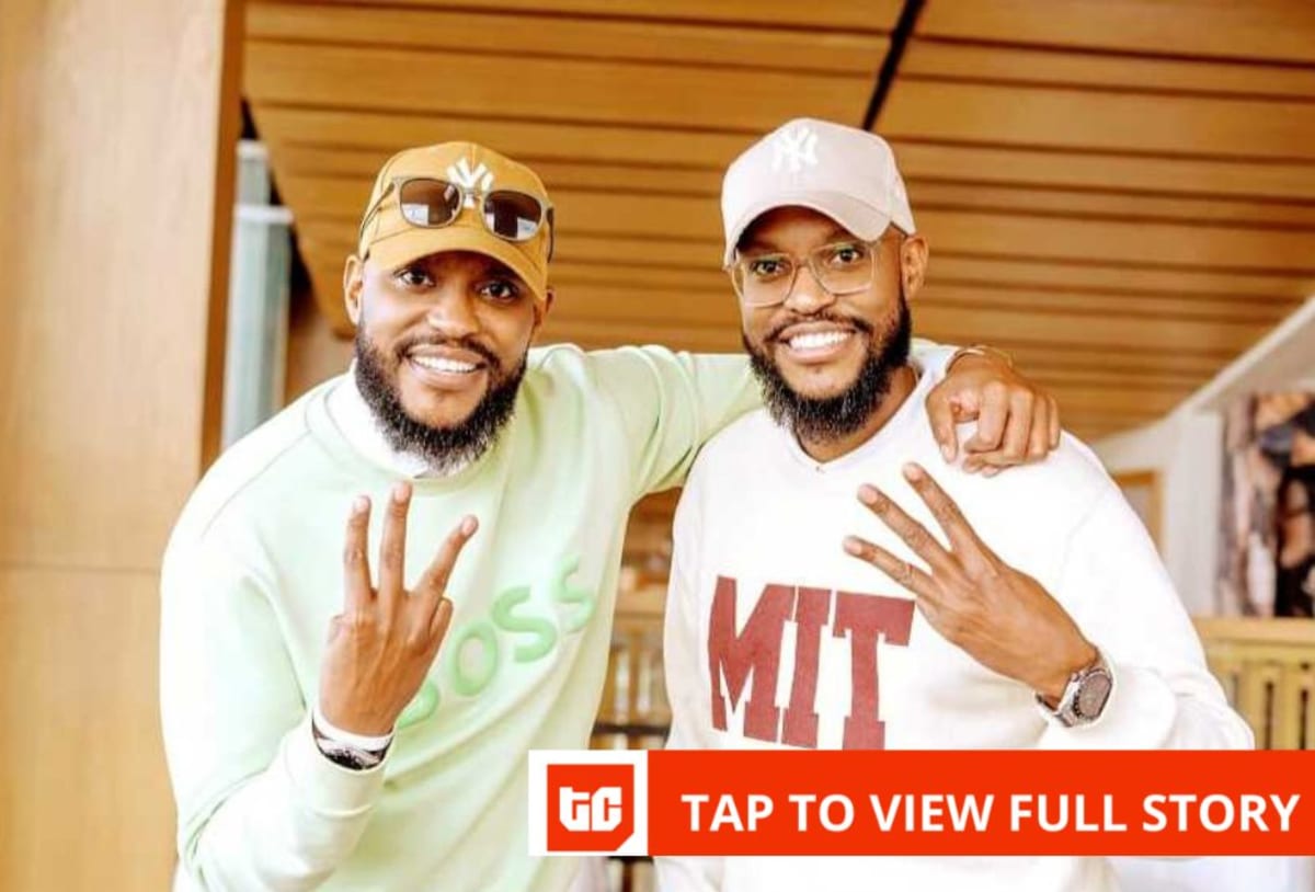 Eddie and Paul Ndichu standing in their modern WapiPay office overlooking Nairobi skyline