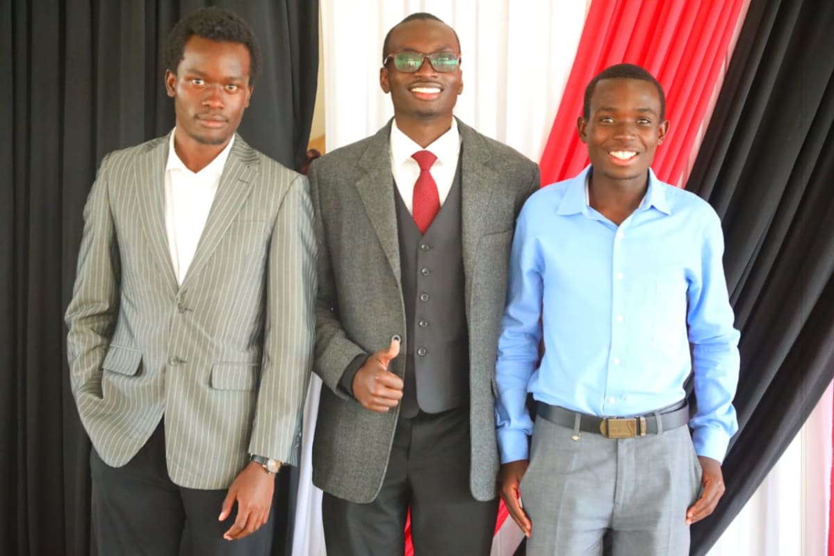 Young African entrepreneur working on laptop computer in university setting, building artificial intelligence technology