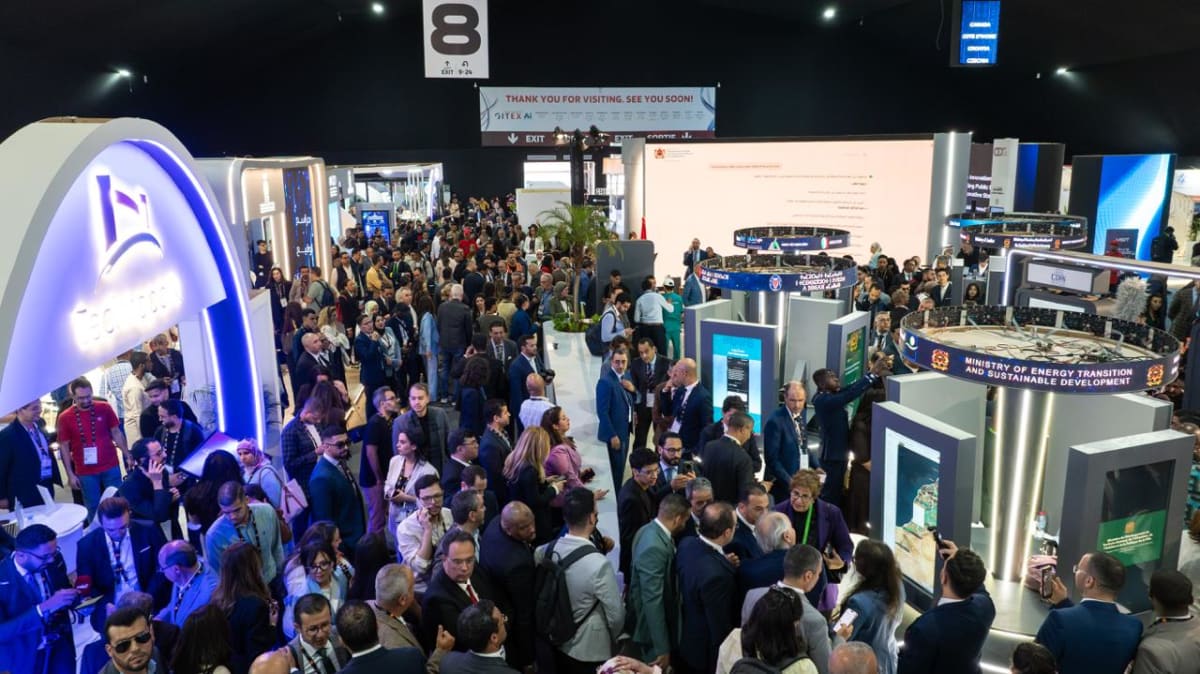 Crowded exhibition halls at GITEX Africa technology conference in Morocco with startup booths