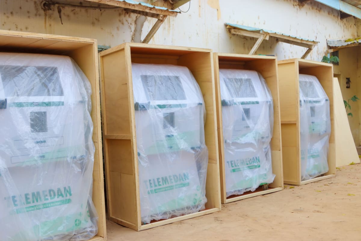 Patient inside Telemedan's solar-powered medical kiosk during remote doctor consultation in rural Chad