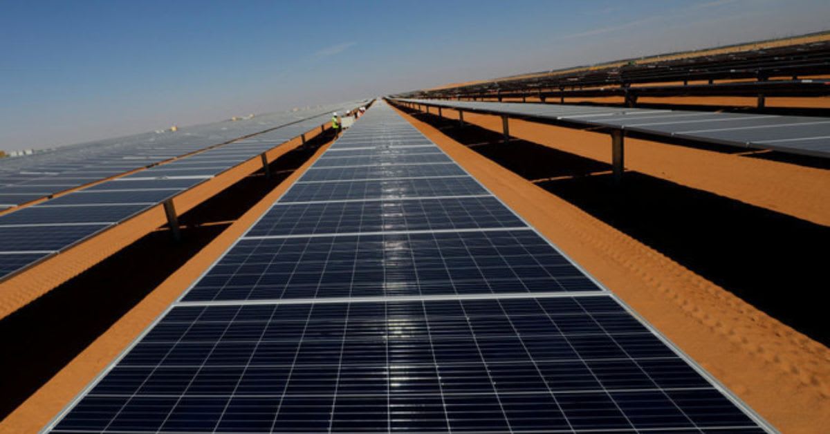Solar panels installed across African landscape with power lines extending to communities