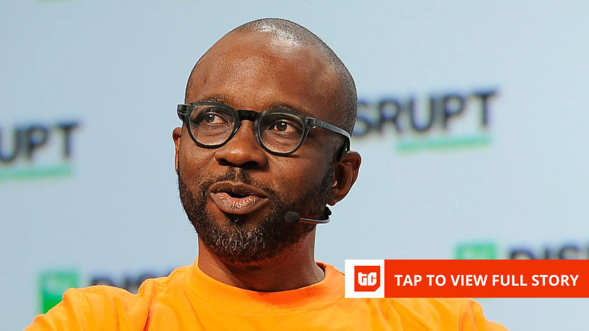 African person using mobile phone to access digital investment and financial services platform