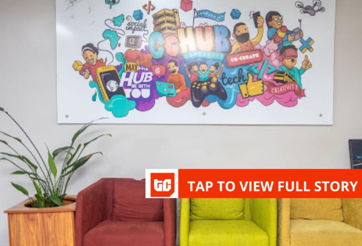 Entrepreneurs collaborating at desks in CcHUB innovation hub in Lagos, Nigeria