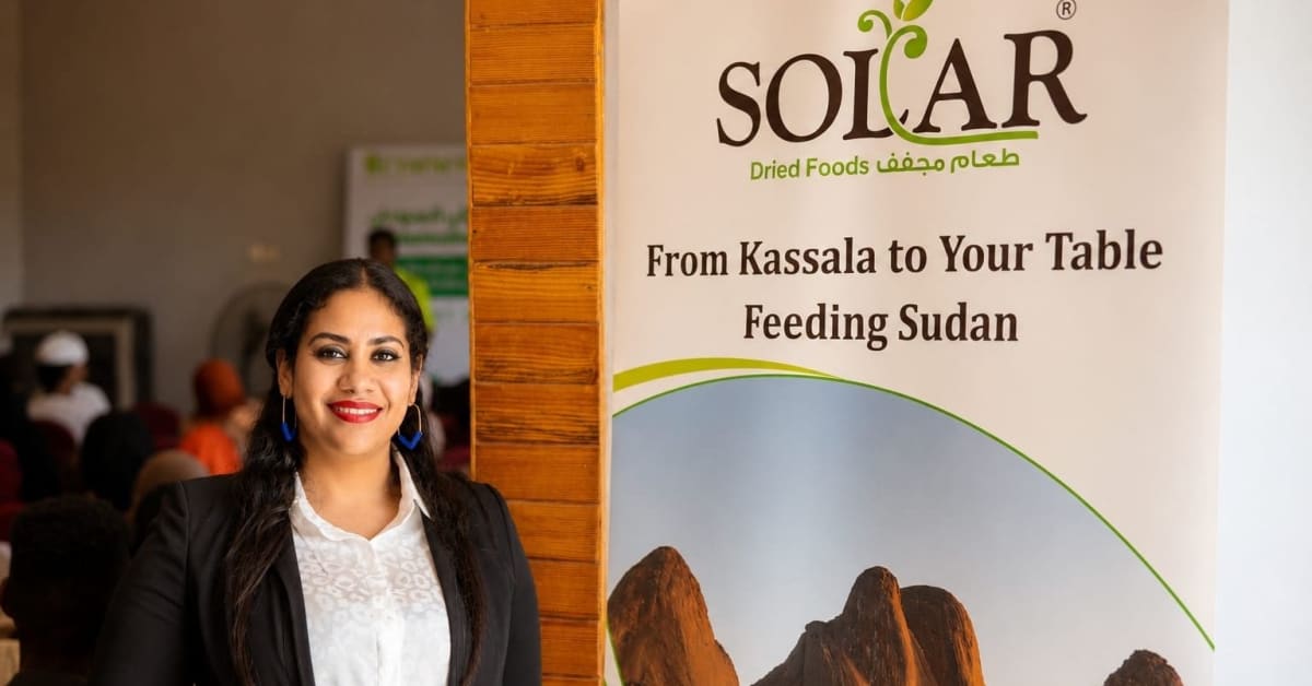 Alaa Hamadto standing in the debris of her destroyed solar food factory in Khartoum