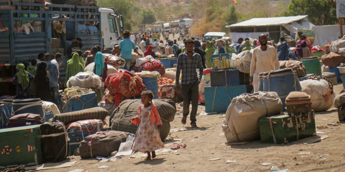 Ethiopian officials and refugee families celebrate access to digital ID cards enabling economic opportunities