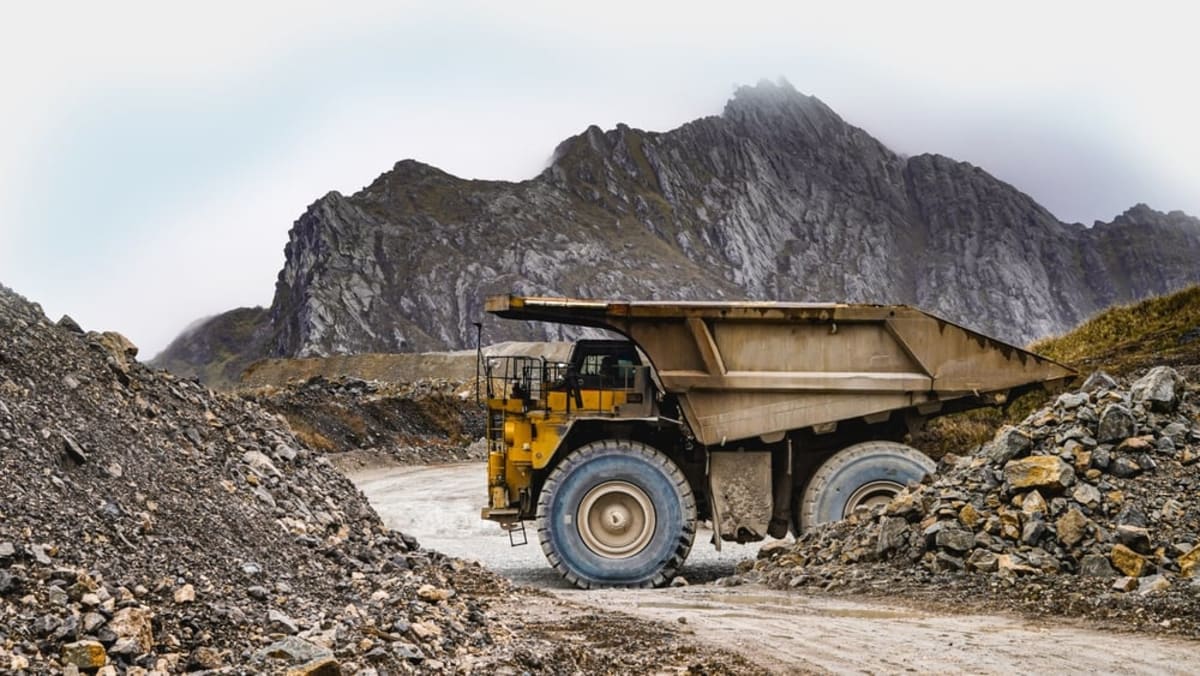 Large mining truck transporting ore at an open pit mine in northern Canada
