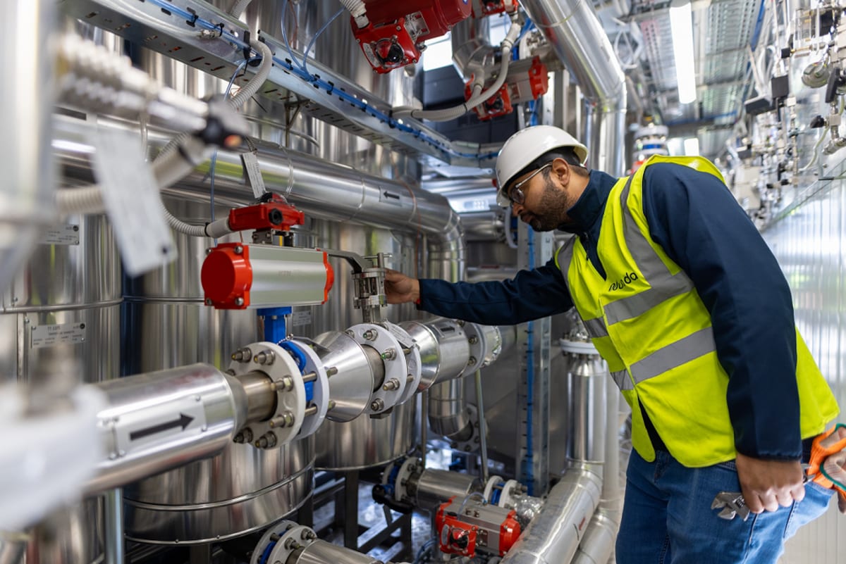 ** Industrial carbon capture facility with storage tanks and pipes in France