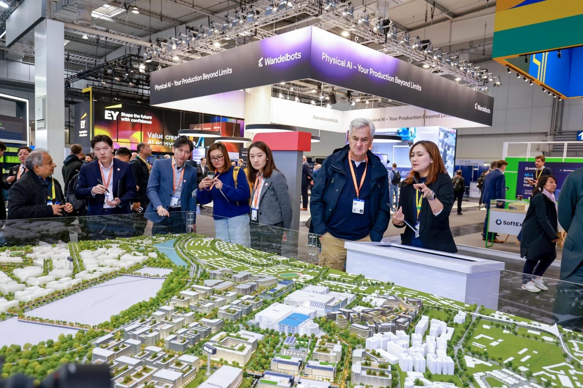 Visitors examining scale model of Jurong Innovation District at Singapore pavilion, Hannover Messe 2026