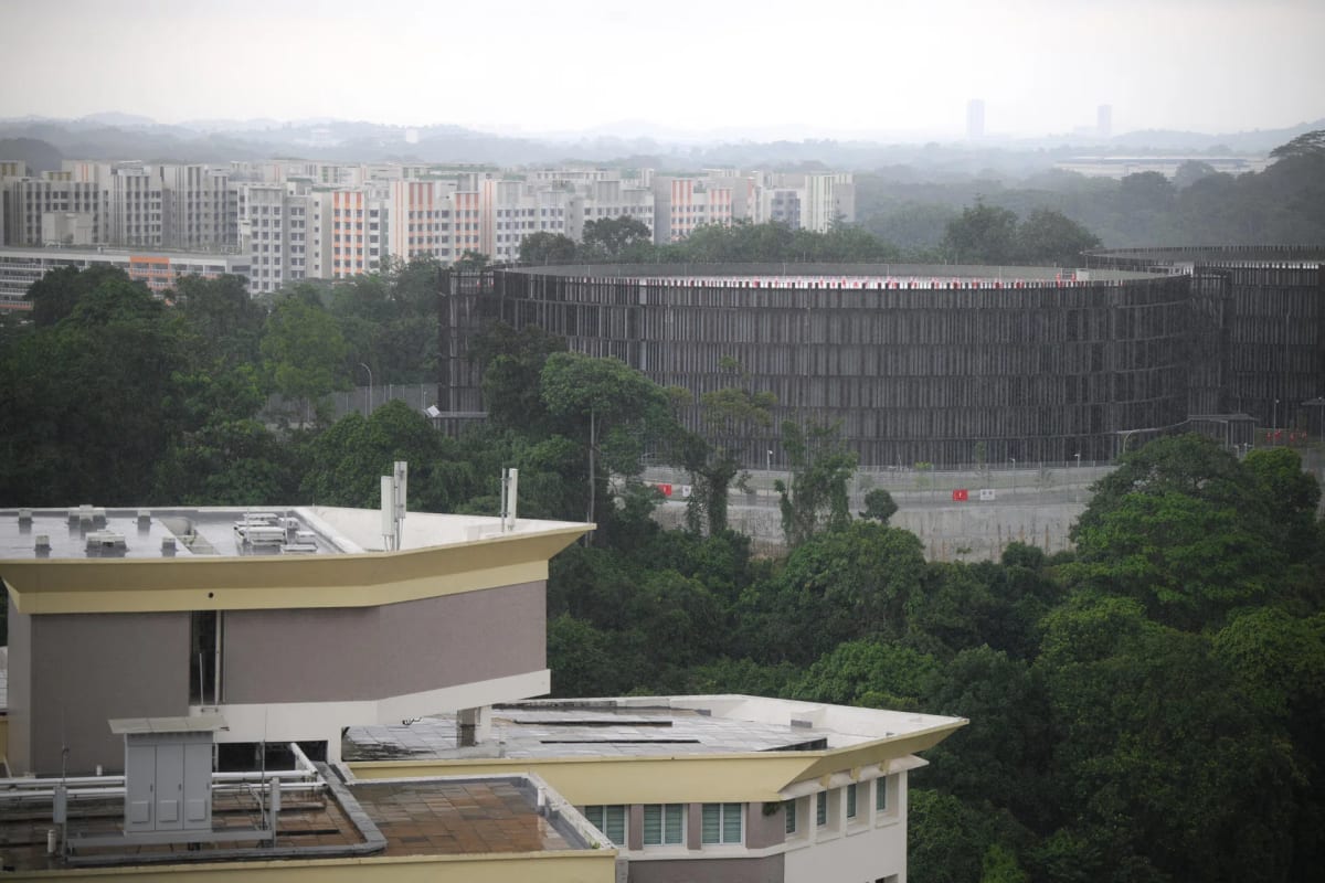 Large modern water reservoir facility with multiple cylindrical tanks at Tengah, Singapore's newest town