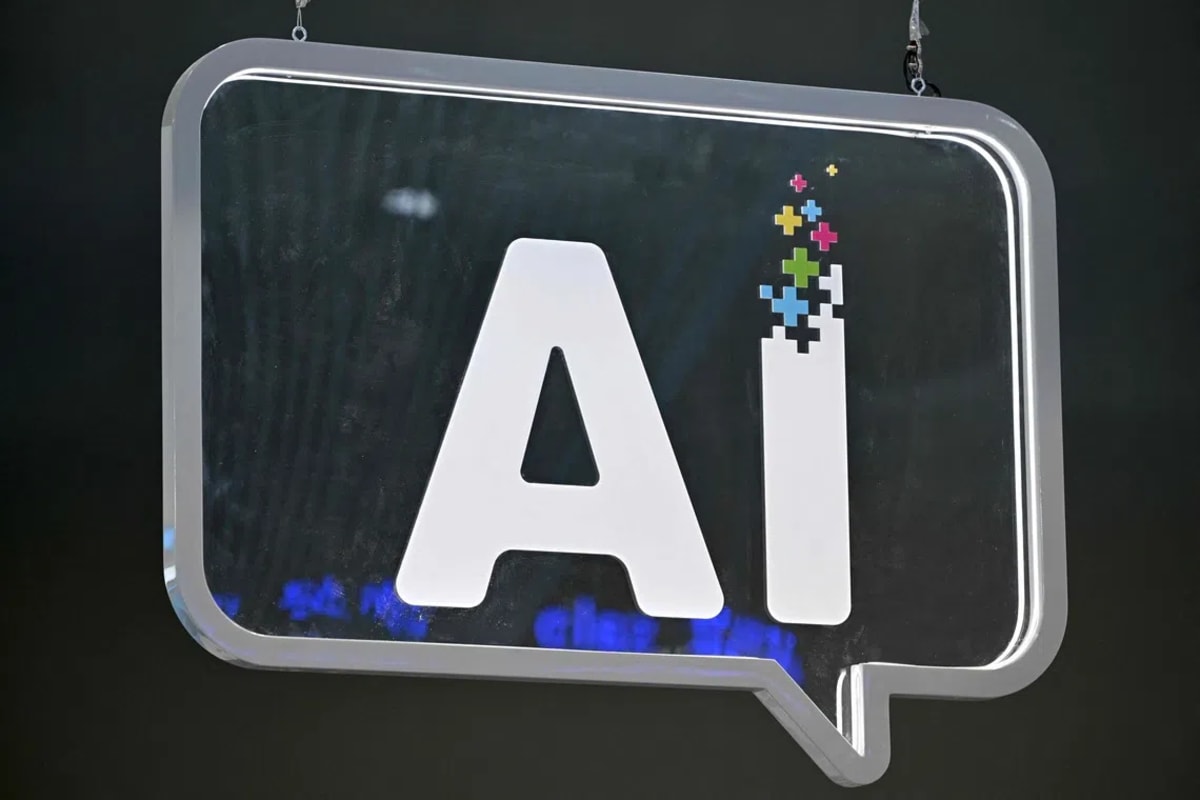 ** Engineers testing artificial intelligence systems on computer screens in Singapore technology facility