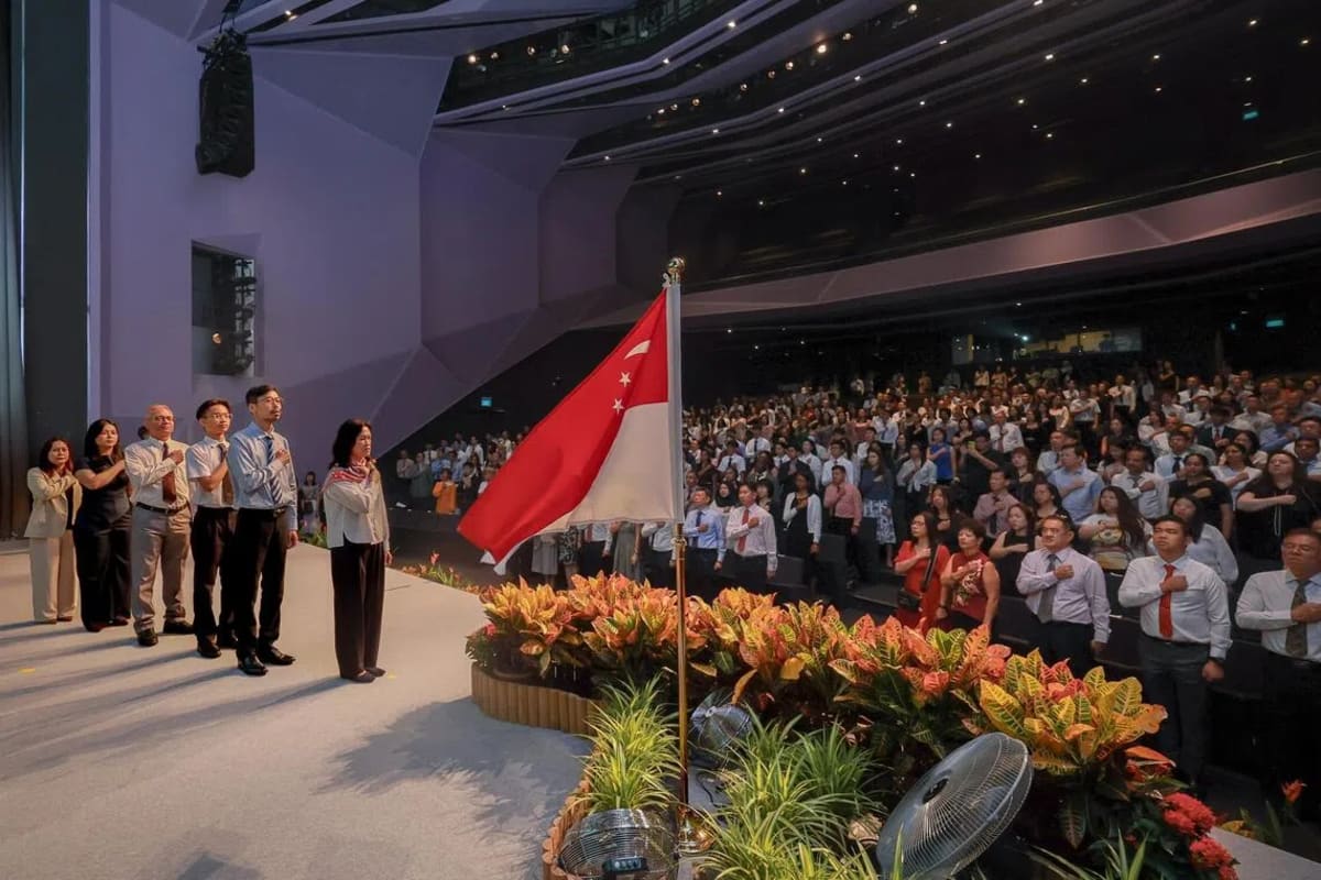 New Singapore citizens reciting the National Pledge together at citizenship ceremony