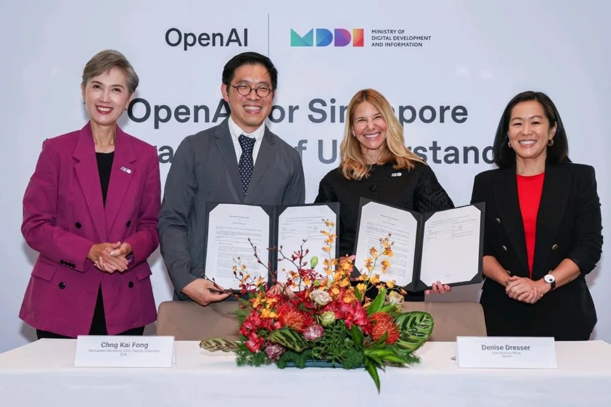 Singapore and OpenAI officials signing partnership agreement at Asia Tech conference ceremony