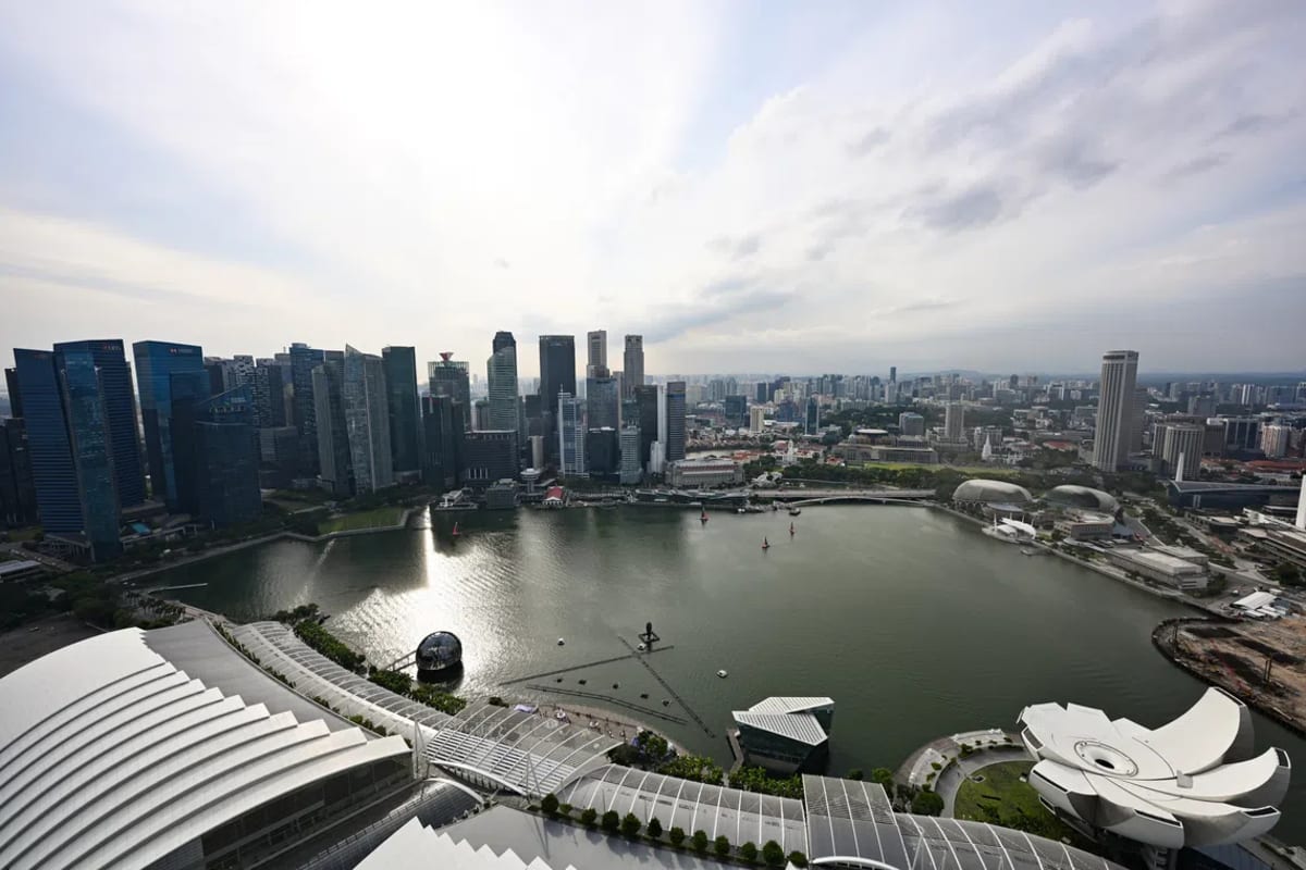 Modern Singapore research laboratory with scientists working on advanced technology development projects