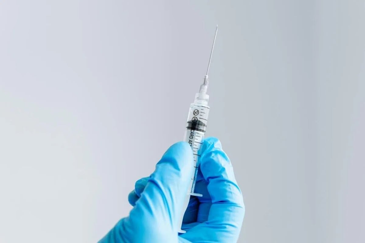 Medical vials of vaccine lined up in pharmaceutical manufacturing facility in Malaysia