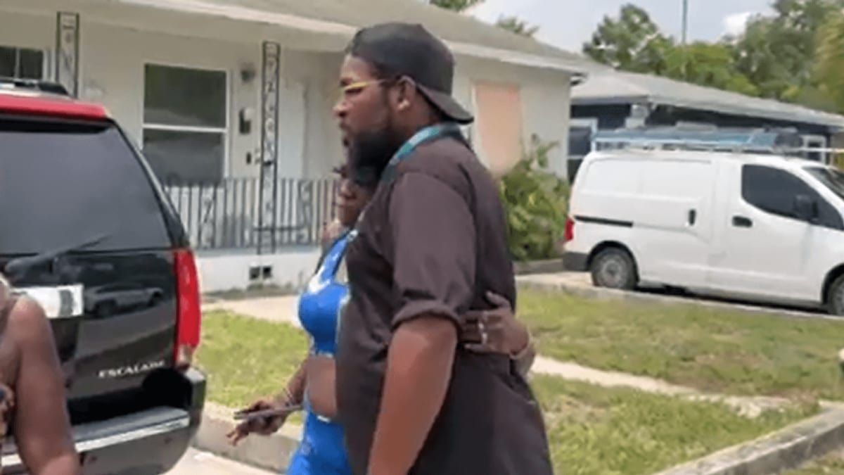 Zeretha Johnson hugging Antonio Thompson during their emotional reunion in Riviera Beach