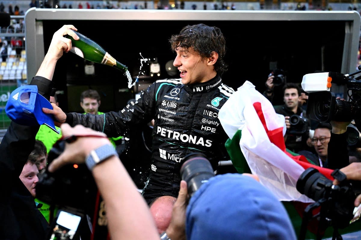 Kimi Antonelli holding his original Chinese Grand Prix winner's trophy from Mercedes Formula 1