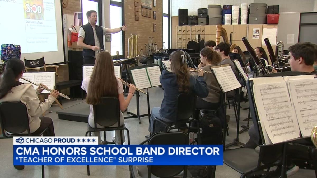 Band director David Hutter leading students during rehearsal at Maine South High School