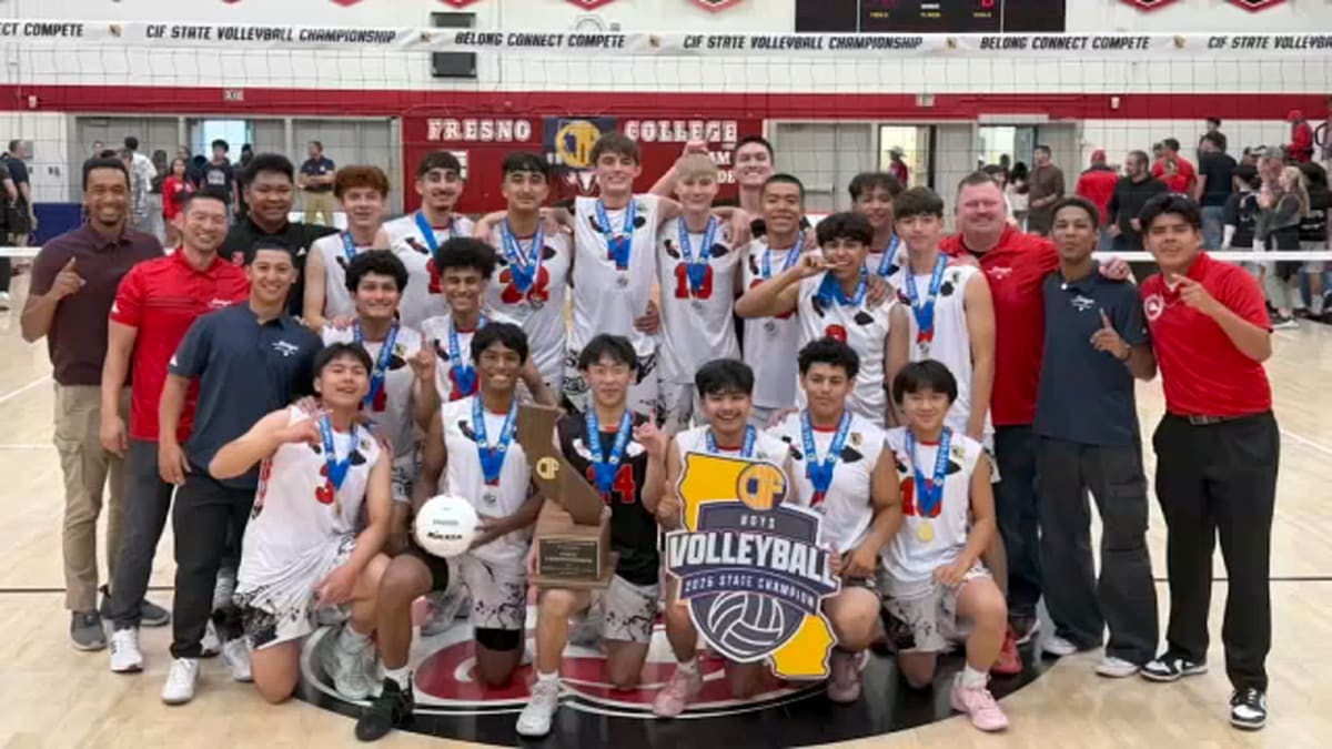 Sanger High School boys volleyball team celebrating their historic first state championship victory