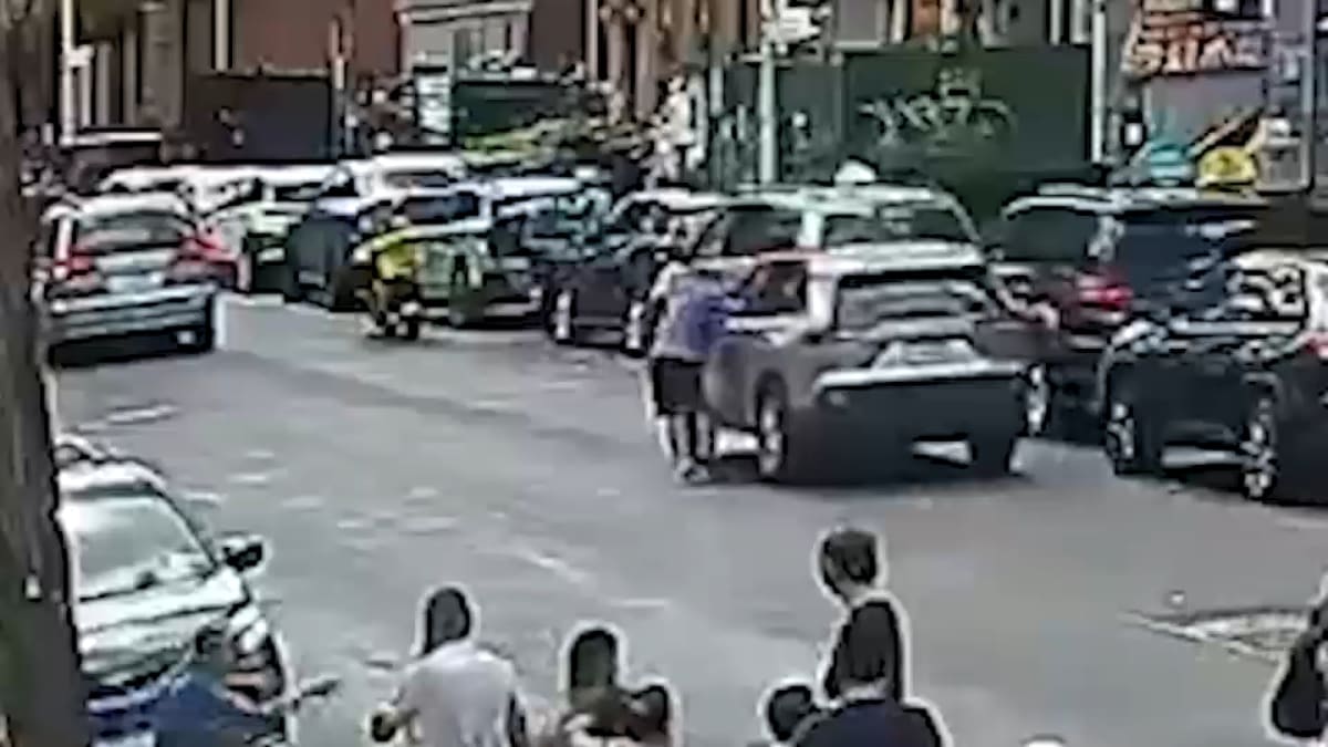 Surveillance camera footage shows NYPD officer performing CPR on unconscious driver in Brooklyn street