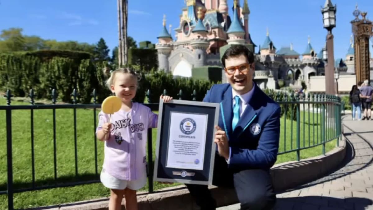 Young toddler Bootsie Darrington celebrating at Disney theme park with family after world record