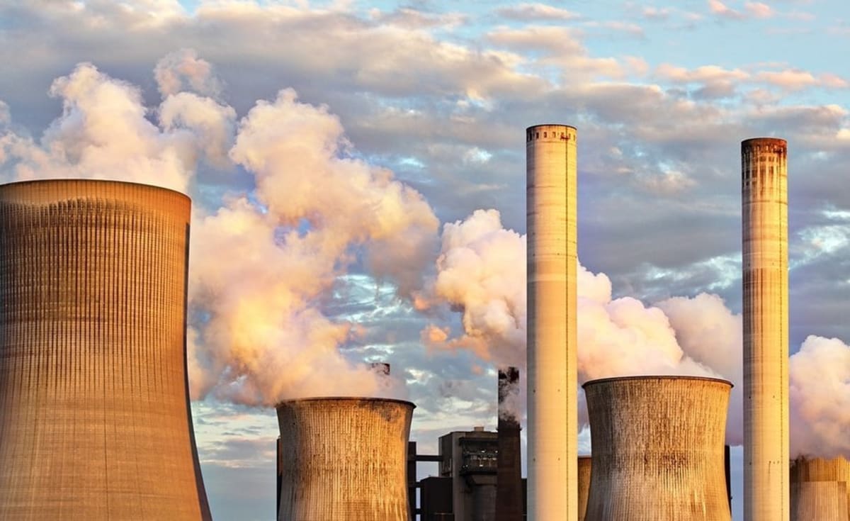 Ethiopian and Russian officials shaking hands at nuclear energy cooperation signing ceremony