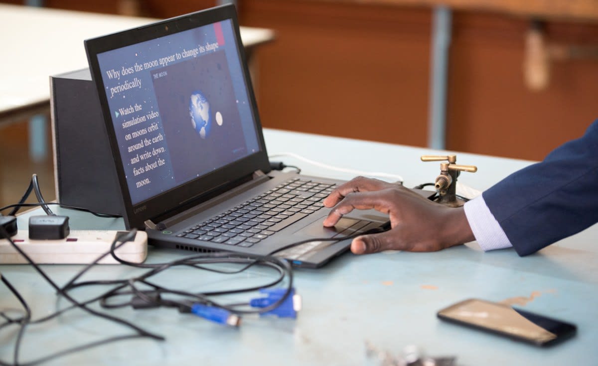 Small modern data center facility next to solar panels and geothermal plant in Kenya