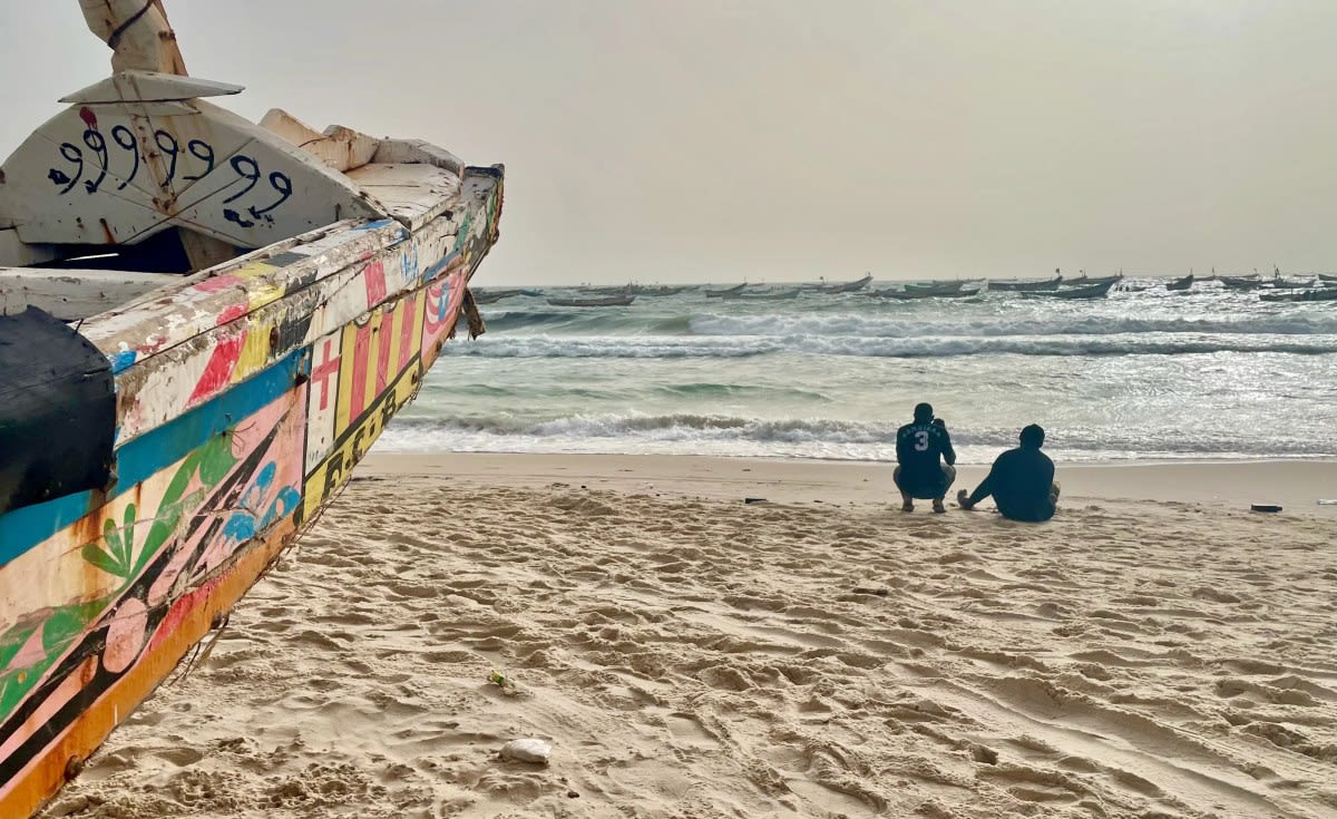Aerial view of African coastal waters with fishing boats and thriving marine ecosystem