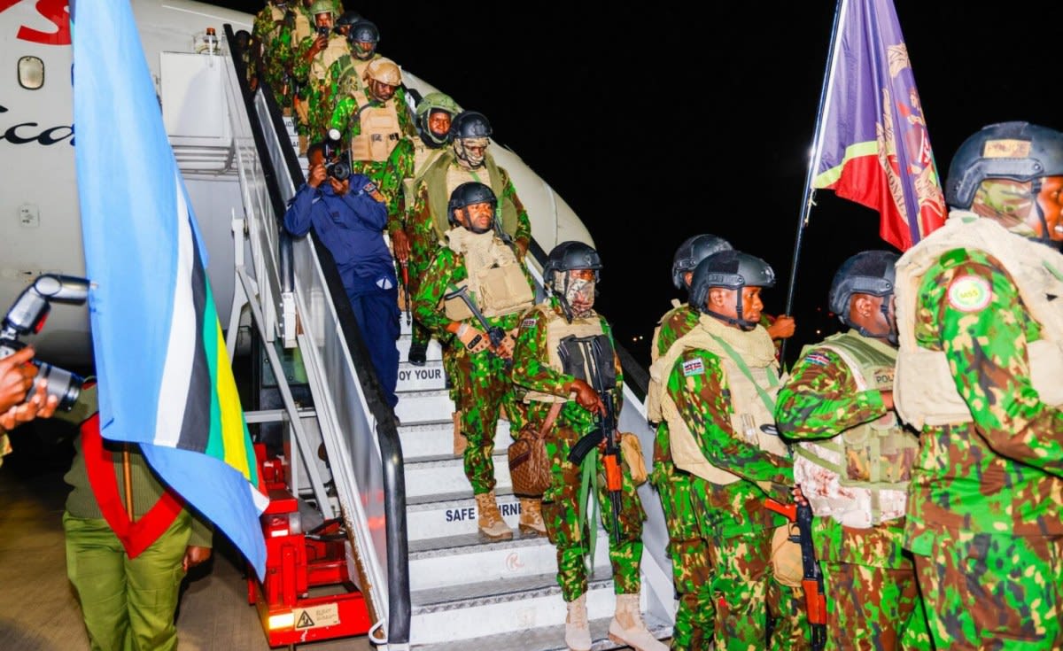 Kenyan police officers in uniform being welcomed at Nairobi airport after Haiti peacekeeping mission