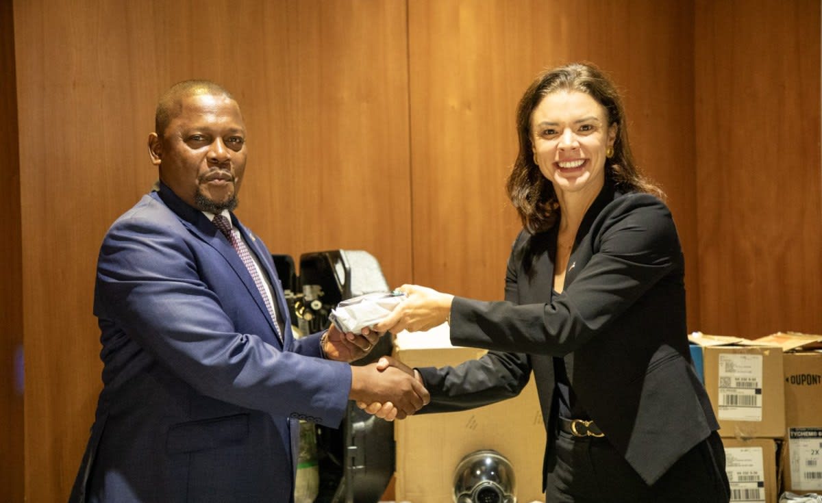 US and Mozambican officials standing together during protective equipment handover ceremony in Maputo
